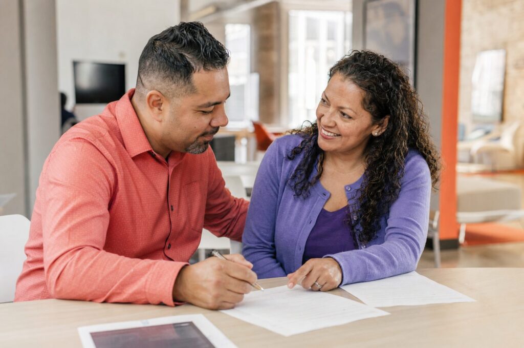 Employees practicing workplace English conversation skills during corporate ESL training